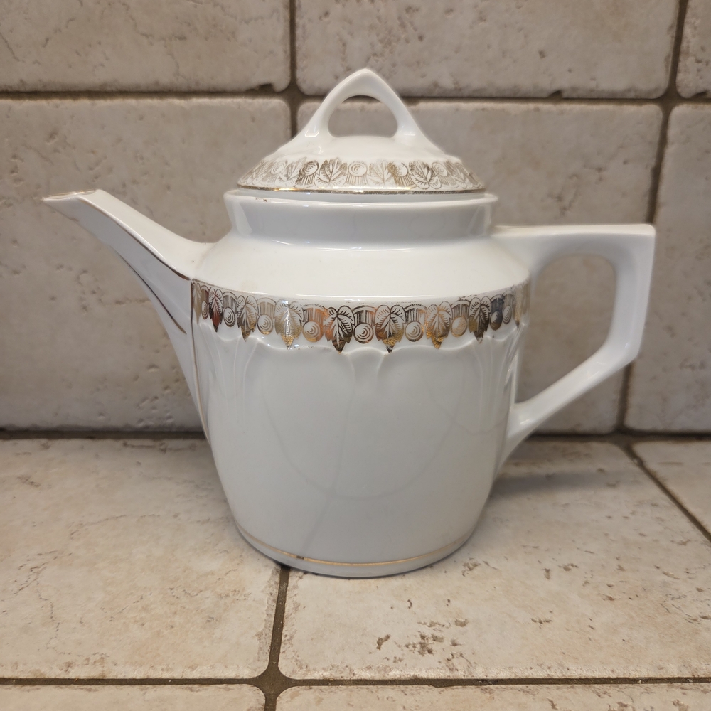 Elegant White and Gold Teapot